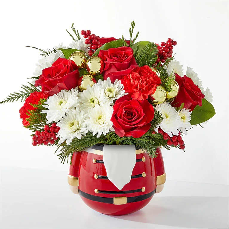 Merry Magic Nutcracker - Merry Magic Nutcracker Share in the nostalgia of the season with a collectable nutcracker vase perfectly accented with holiday blooms.