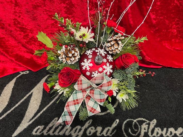 CHEER IN THE AIR - A red ceramic ornament that can be refilled year after year. This year it is filled with winter greens and red and white flowers. 