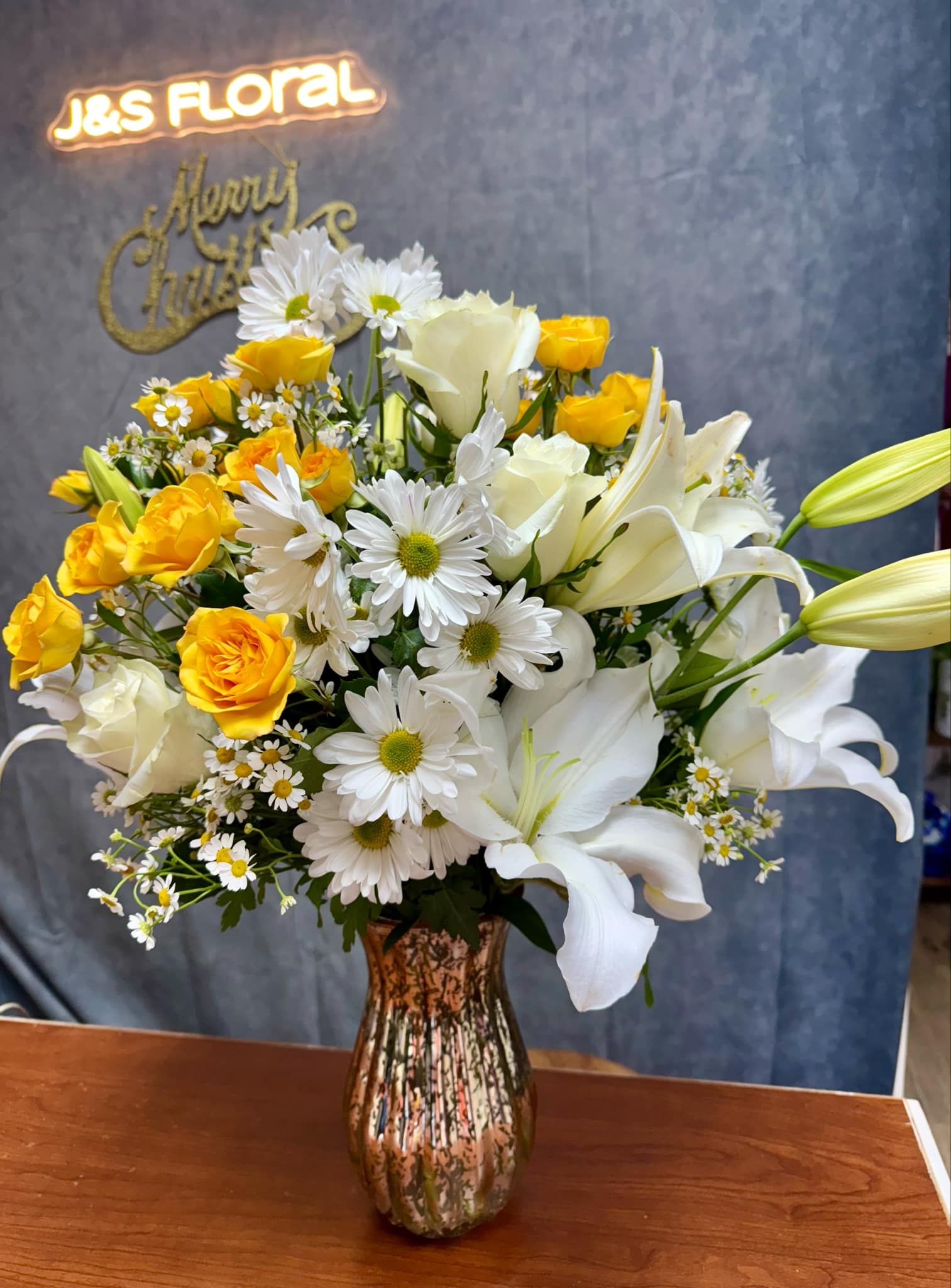 Sunny Elegance  - Brighten any day with our handcrafted Sunny Elegance floral arrangements, perfect for any occasion or just because. Designed with fresh, seasonal blooms in a variety of colors and styles, these arrangements bring beauty and joy to any space. Whether you’re celebrating a milestone, showing 