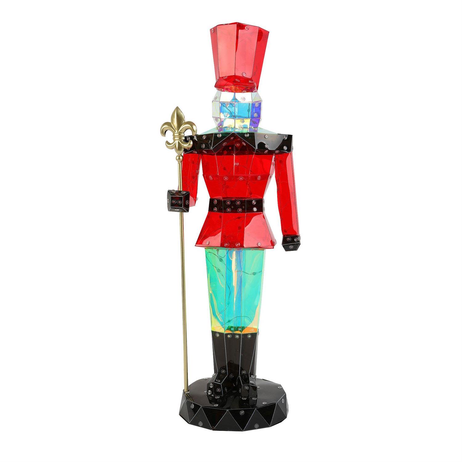 Faceted Acrylic Lit Nutcracker - ring bold color and brilliant sparkle to your holiday décor with this striking Faceted Acrylic Lit Nutcracker. Standing 39.4 inches tall, this decor piece is crafted from high-grade, jewel-like acrylic panels that catch and refract light, giving the nutcracker a dazzling, crystalline appearance from every angle. The vibrant red jacket, iridescent trousers, and black accents create a modern, elegant twist on the classic holiday figure.  What sets this nutcracker apart is its programmable lighting, featuring red, green, blue, and white LEDs that glow through the faceted acrylic like stained glass brought to life. USB-powered for easy indoor placement, it offers both convenience and brilliance—perfect for mantles, entryways, tabletops, or anywhere you want a festive focal point.  Lightweight yet visually impactful, this illuminated nutcracker adds an exciting, contemporary element to your celebrations. 