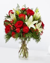 Joyful Greetings - Spread cheer to your loved ones near or far with the Joyful Greetings Bouquet, full of cozy red and white blooms perfectly capturing the holiday spirit. Details Designed by florists, ready to display. Vase style/shape may vary For long–lasting blooms, replace the water daily. We suggest trimming the stems every couple days. Pet Safety Precautions: This bouquet or plant may include flowers and foliage that are known to be toxic to pets. To keep them safe, be sure to keep this arrangement out of your pet's reach.