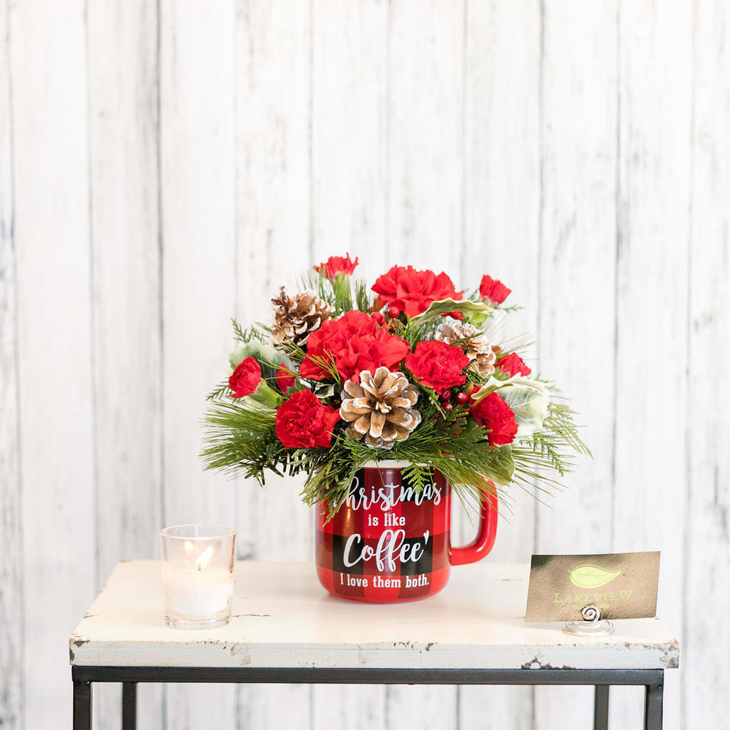 Plaid - Nothing says cozy like plaid!  After enjoying an arrangement of fragrant evergreens, carnations and pinecones, use the mug for a steaming cup of coffee, tea or cocoa!  Approx: 9&quot;H x 9&quot;W