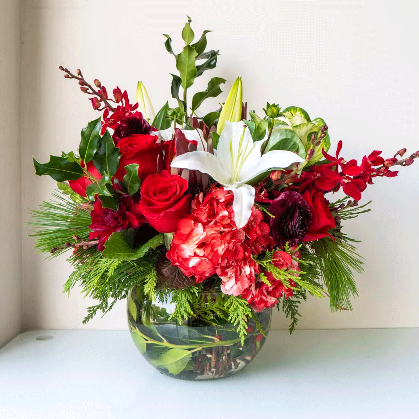 TOUCH OF HOLLY - TOUCH OF HOLLY -  HYDRANGEA, LILY, WINTER GREENS, HOLLY, RED ROSES, KALE, RANUNCULUS,, OTHER SEASONAL GREENERY AND SEASONAL FLORALS