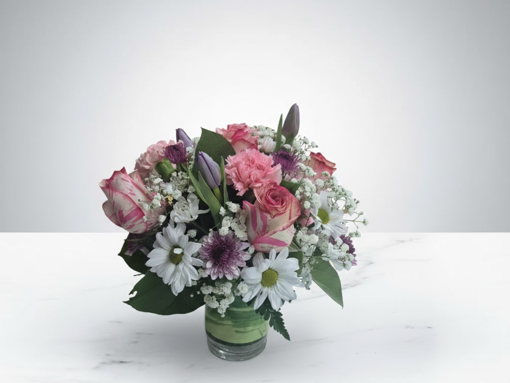 Sweet Surrender - The Sweet Surrender bouquet, a delicate blend of affection and charm. Soft pinks and whites create a harmonious display, perfect for expressing heartfelt emotions. This arrangement is a beautiful way to show someone they're cherished.