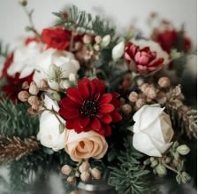 Designer's Choice Premium - A wonderful selection of our most premium flowers in seasonal Christmas colors with touches of holiday greenery