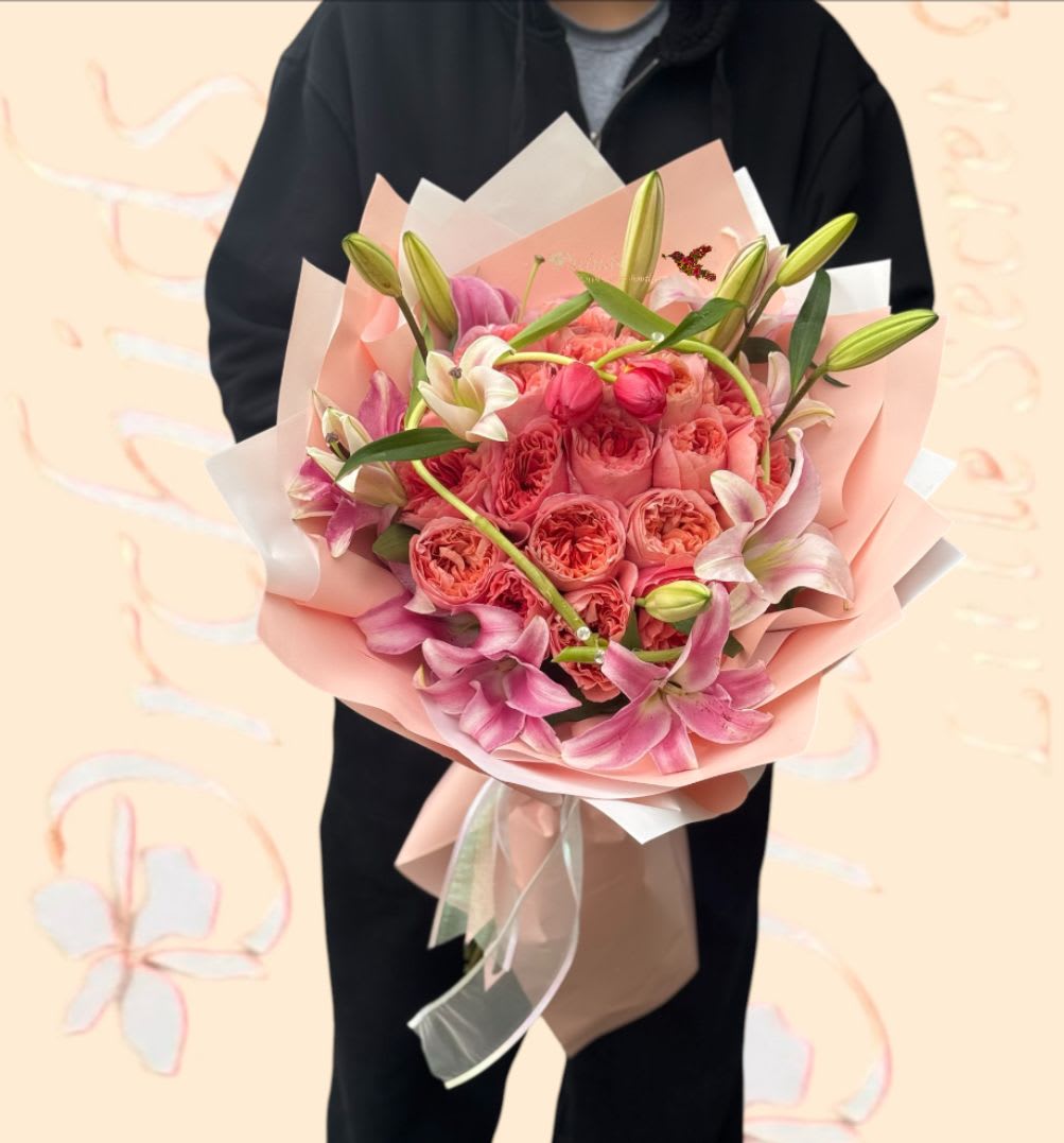 Pink Xpression Garden  Roses Stargazer Lilies Tulip Heart Wrapped Bouquet  - Wow your love with this impressive bundle of stargazer lilies,  pink premium roses  hand wrapped bouquet. Wrapped in gift Korean paper and dressed with ribbon, and tulips heart shaped in the middle ! This delivery will light up her day! Perfect gift for Valentine's Day, birthday, anniversary, or any other occasion.