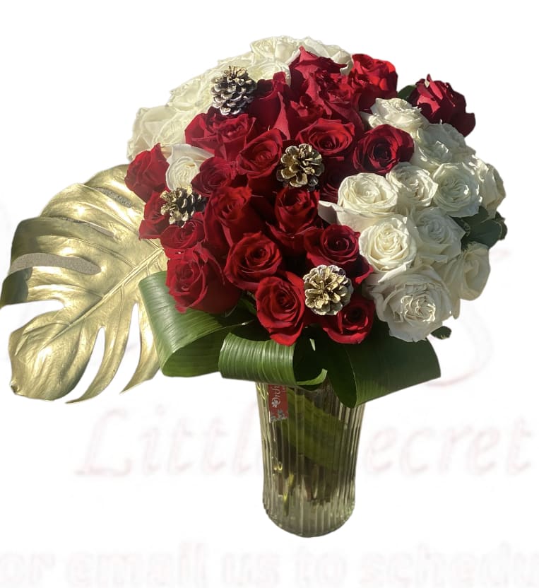 Winter Modern 4 Dozen Red &amp; White Rose Bouquet  - Send  Winter Modern 4 Dozen premium Red &amp; White Rose Bouquet, adorned with winter pine cones and gold monstera leaf - is a timeless gift for your beloved.  Bouquet measures approximately 22”H  arranged in a 11 inch clear vase  