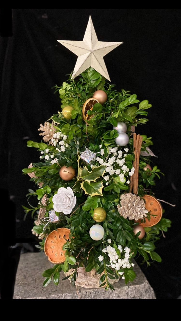 Rustic Boxwood Tree - Or handmade custom boxwood trees are spectacular in every way.  They are lovingly assembled and then decorated to perfection.  This style of tree is a rustic version with dried citus slices, cinnamon sticks and wooden flower blooms.  This lovely, casual style fits perfectly into almost any New England Home. 