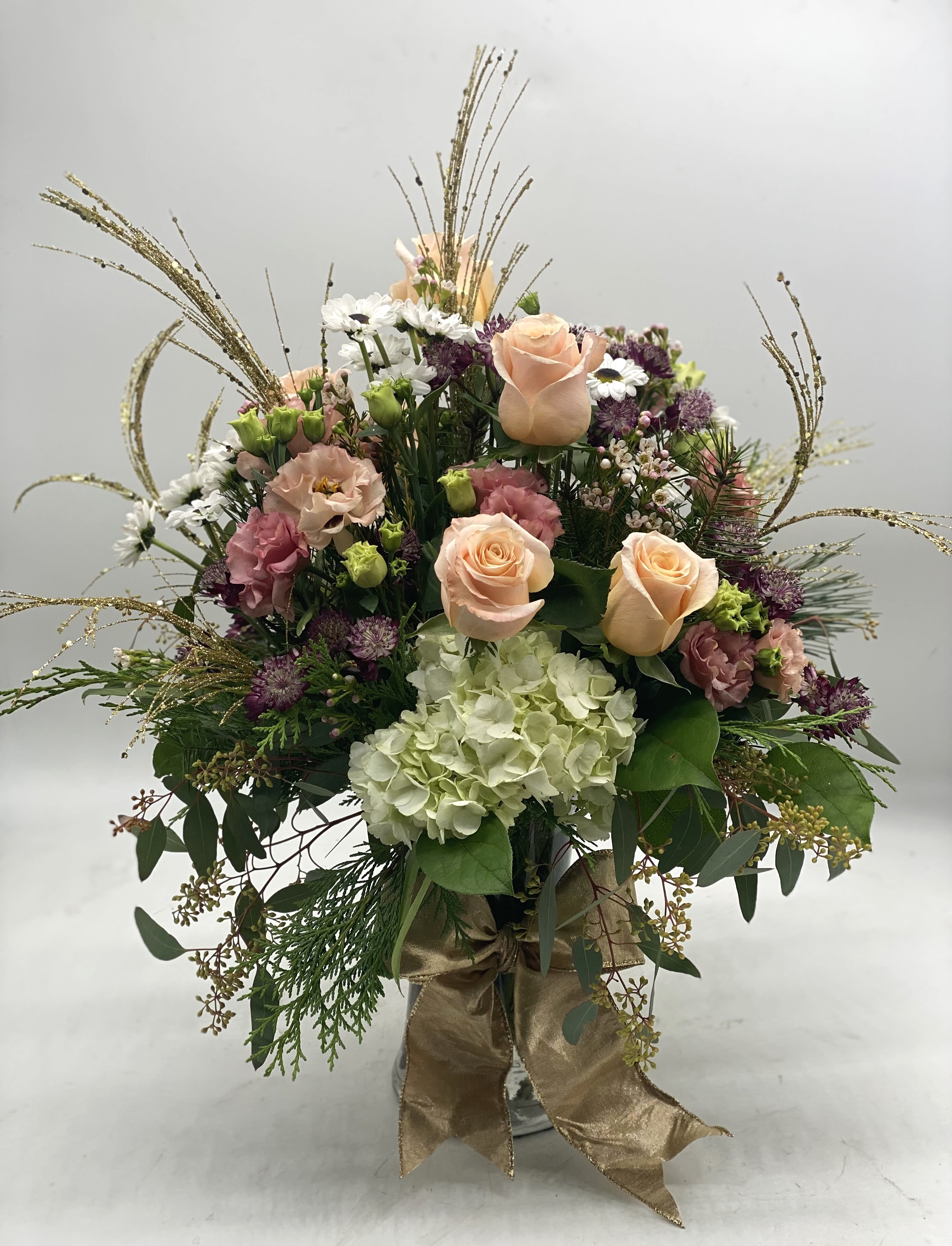Golden Glow Bouquet - A great arrangement to welcome the new year! Fresh, bright blooms designed in a clear vase finished off with a gold bow and gold &quot;fireworks&quot;!