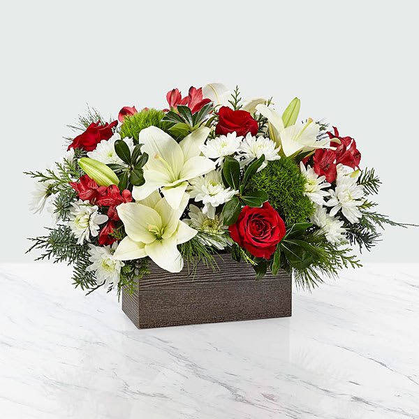I'll Be Home Bouquet  - Nothing says happiness and joy more like coming home to the ones you love most. An artful collection of white cushion pompons and Asiatic lilies with contrasting red roses and alstroemeria makes those precious moments this season all the more special. They all arrive in a rustic, weathered wooden rectangular box.