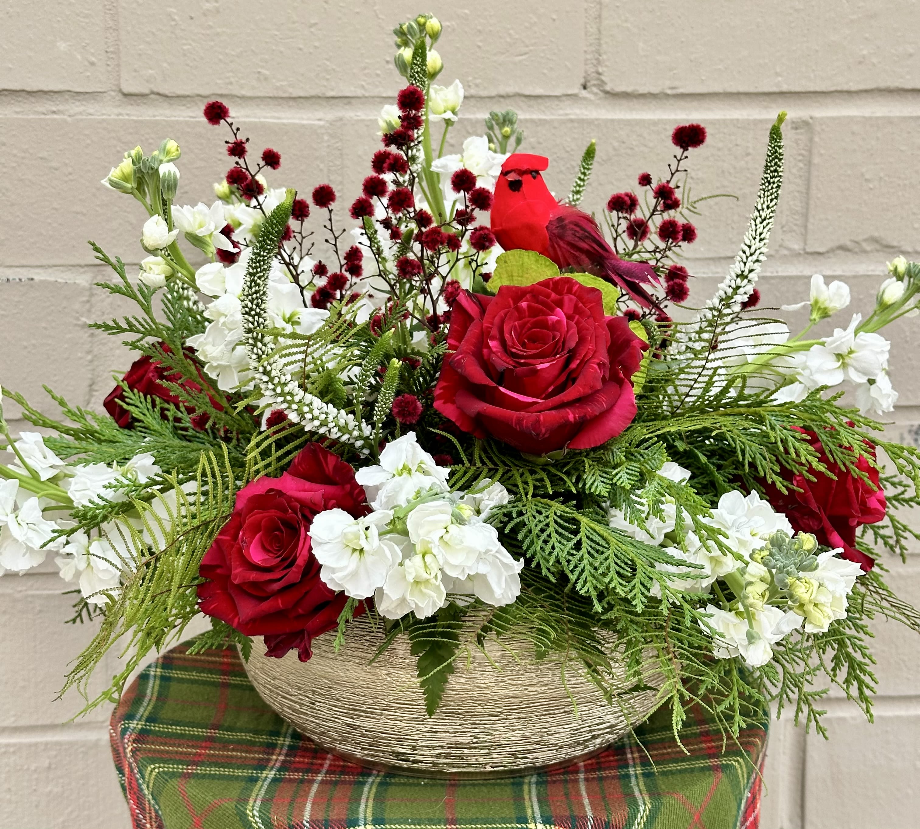 Cardinal's View  - Roses, Stock, Veronica, Berries, Winter Greens and more rest in this Golden Planter  Over the Watchful Eye of a Cardinal. 