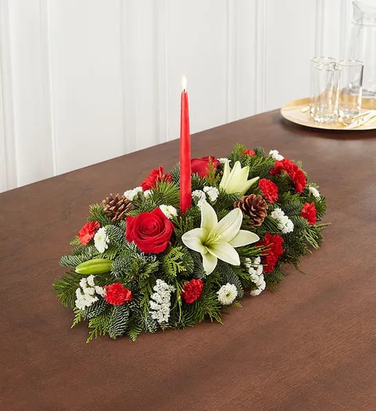 Lilies, red roses red carnations, christmas greens centerpiece with Candles - Beautiful long and low centerpiece with white lilies, red roses red carnations, christmas greens centerpiece with Candles
