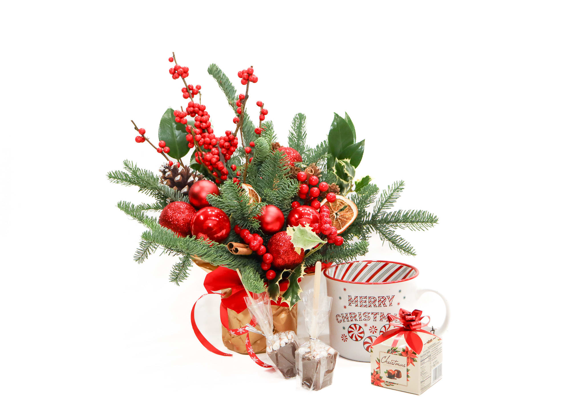 Hot Chocolate Twist - Who doesn't love hot chocolate? That why we prepared the perfect gift, one Christmas arrangement, one cup, one mini box of chocolate and two stick of hot chocolate.  