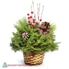 Holiday Basket of Mixed Greenery - Our elegant Holiday Basket is made with a long-lasting fir base and mixed greens in a high-quality basket. The greens are set in a floral oasis that can be watered for continuous enjoyment throughout the holiday season. Comes with decorative pine cones and berries added for a festive flair.