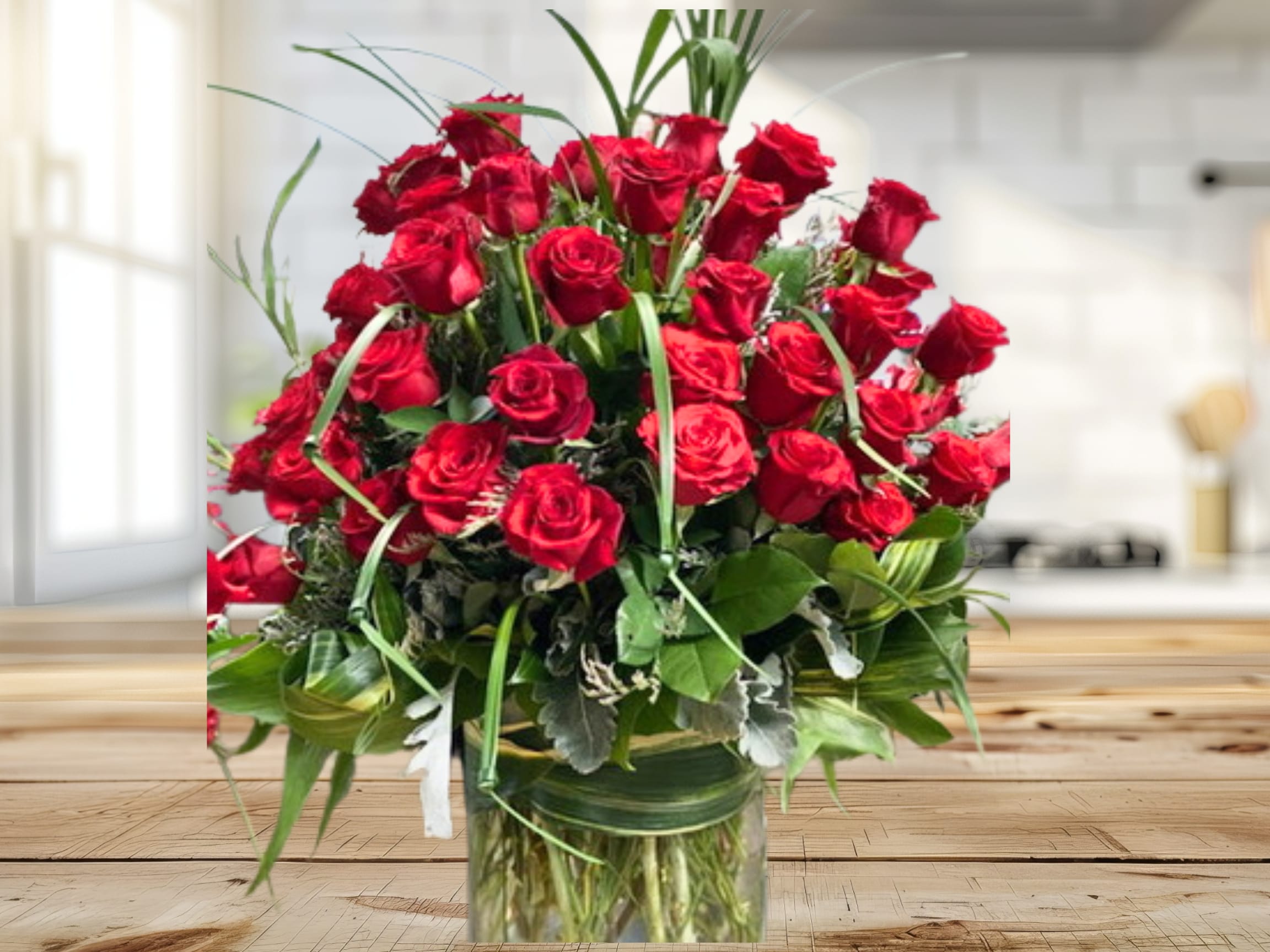 Everlasting Passion -  Fan you passion into flame by splurging on your sweetheart. Roses are always a classic lovers choice. Our most luxurious rose offer of 100 premium roses with greenery and floral accents designed in a custom vase. 