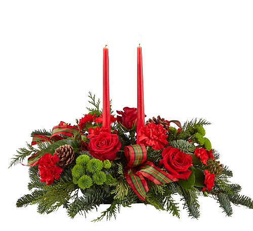 By the Candlelight Centerpiece - Let time fly By the Candlelight centerpiece as new holiday memories are made. What better way to commemorate the joyful homecoming than with classic red roses and lush evergreen accents?