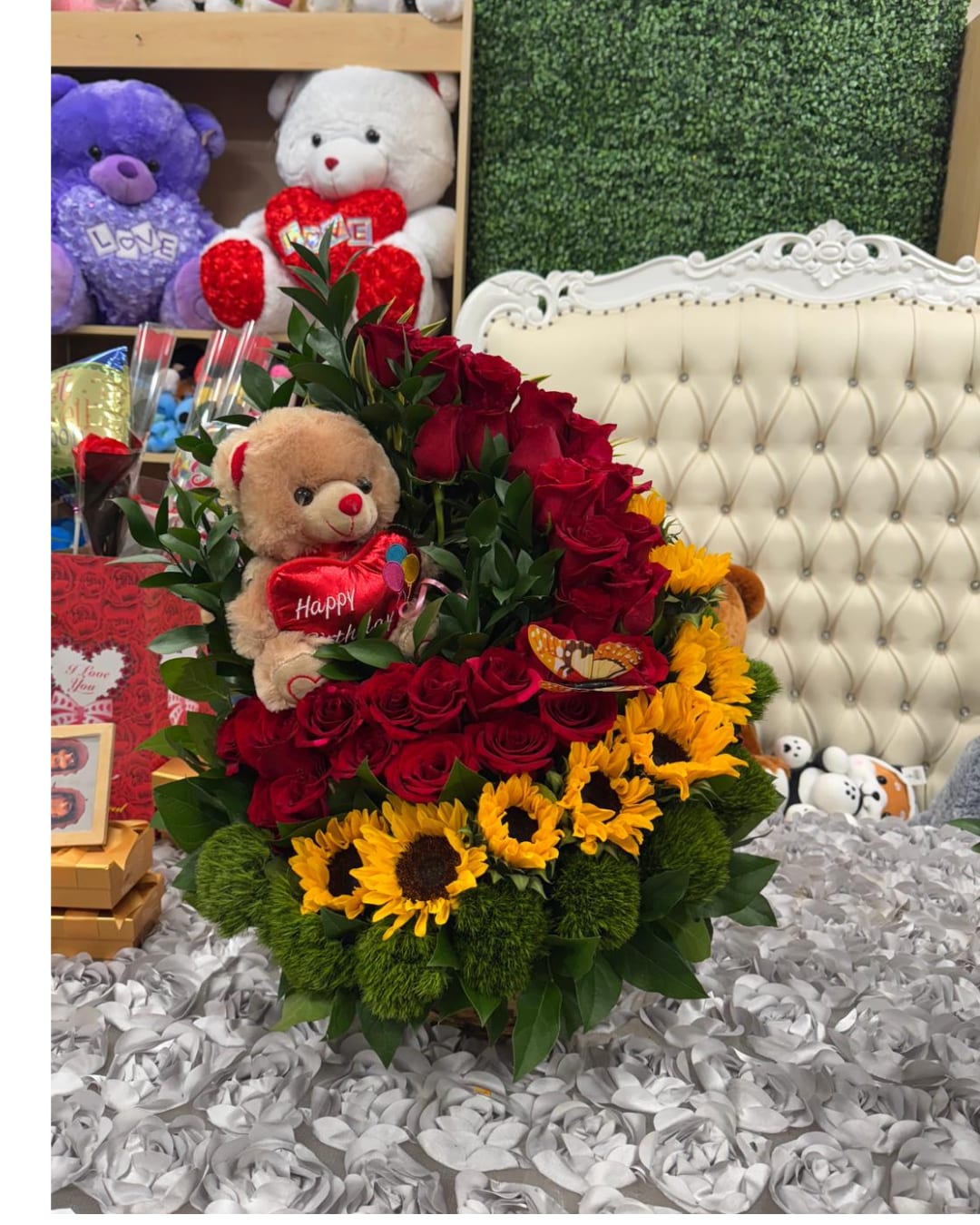 Floral Euphoria. - It is a lush arrangement that combines the passion of red roses with the vitality of golden sunflowers.