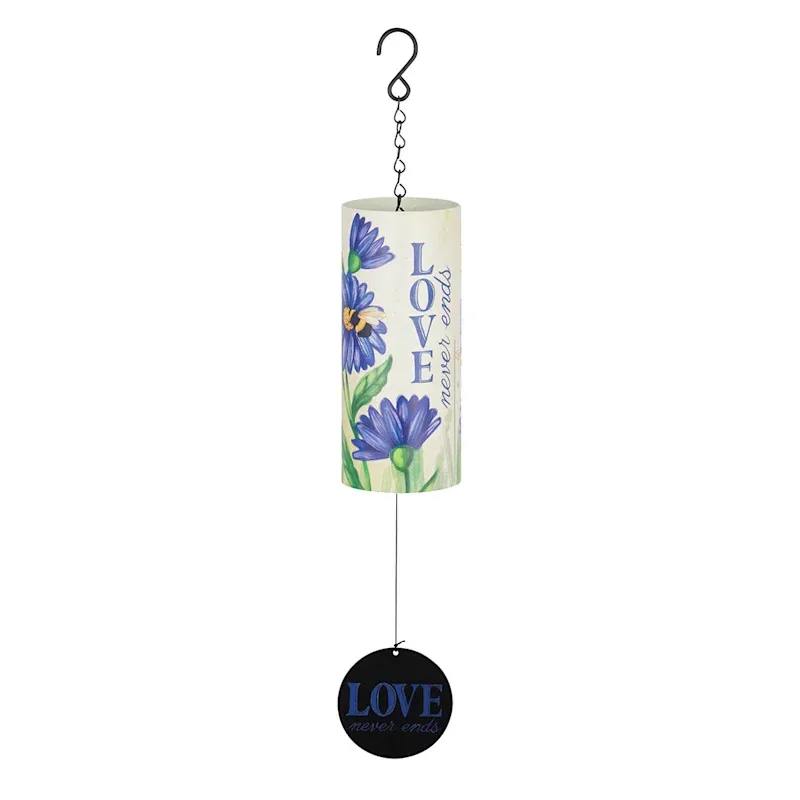 Carson 18" Cylinder Wind Chime - Love Never Ends - Add a touch of beauty and serenity to your garden or yard with the Bless This Home 18" Cylinder Sonnet Wind Chime. This charming wind chime is designed to be a colorful accent that brings both visual and auditory delight to any outdoor space.  Full-Color Design: The cylinder features a vibrant floral design that enhances its aesthetic appeal. Measuring 7" x 3" with an overall length of 18", this wind chime is the perfect size to make a statement without overwhelming your space.  Durable Materials: Made from UV printed steel and metal, this wind chime is built to withstand the elements. The industrial cord ensures long-lasting durability.  Adjustable Striker: Customize the sound of your wind chime with the adjustable striker, allowing you to achieve the perfect tone to soothe and relax.  Meaningful Sentiments: On the Sail: "Love Never Ends" On the Cylinder: "Family.. Where Life Begins and Love Never Ends"  Easy to Hang: Comes with a hook and chain for convenient hanging, making it easy to display in your favorite outdoor spot.  Perfect for Gifting: This wind chime makes a thoughtful and heartfelt gift for housewarmings, birthdays, or as a gesture of sympathy. The meaningful inscriptions and soothing sounds provide comfort and a sense of peace, making it a beautiful addition to any home.  Paul Davis Flower Shop stocks one of the largest selection of sympathy gift wind chimes available for same day delivery in Muncie, IN.