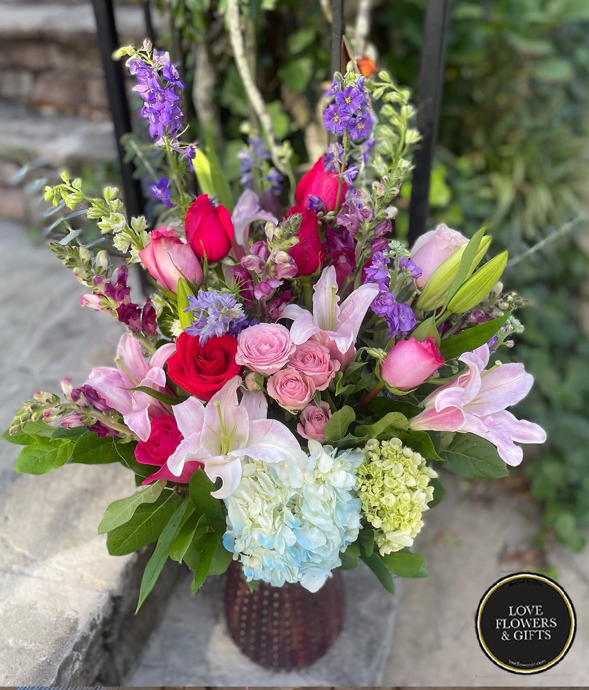Amore - Large and tall arrangement made with various mix of flowers in valentine theme colors 