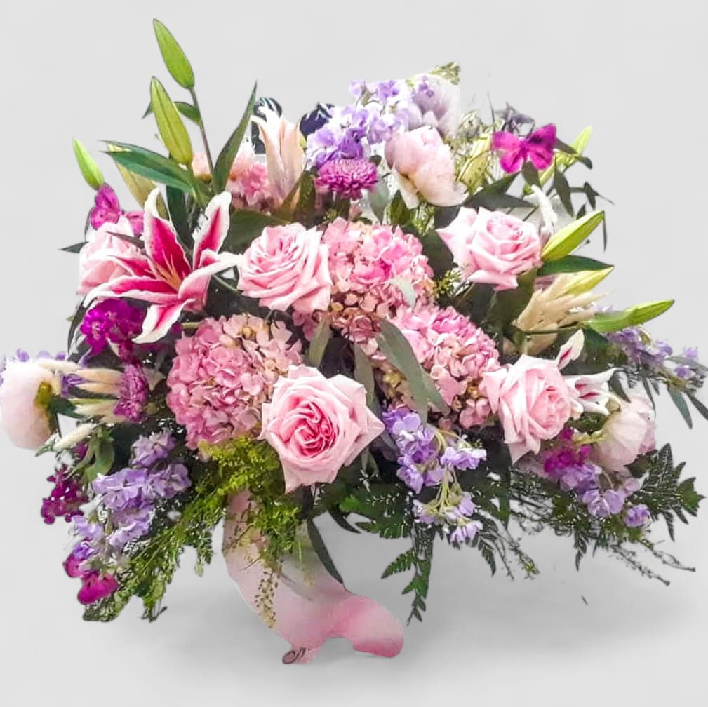 Pink Grace Celebration of Life Casket Spray - Roses, Hydrangeas &amp; Lilies - Honor a beautiful life with our Pink Grace Celebration of Life Casket Spray, a feminine and elegant tribute designed with soft pink roses, lush hydrangeas, and fragrant lilies. Handcrafted by our expert floral designers, this designer's choice arrangement radiates love, remembrance, and serenity. A perfect choice for families wishing to express sympathy with pink funeral flowers, this casket spray brings gentle comfort to the service. Available for same-day delivery to funeral homes in Haddonfield, Haddon Township, Cherry Hill, and surrounding communities, each piece is created with the utmost care and compassion. Please allow 48 hours for premium blooms to arrive fresh from the market.