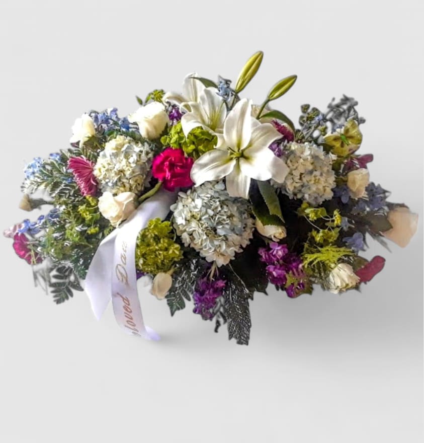 Lavender Elegance Casket Spray - Roses, Orchids &amp; Designer's Choice Blooms - Our Lavender Elegance  Casket Spray is a graceful tribute designed to bring peace, beauty, and love to the service. Featuring soft lavender blossoms, elegant roses, and exotic orchids, this designer's choice arrangement is hand-crafted for a truly personal expression of sympathy. Perfect for families seeking lavender and purple funeral flowers is Haddonfield, Haddon Township, Cherry Hill, and surrounding areas, this casket spray symbolizes eternal love, remembrance, and serenity. Each piece is thoughtfully designed and delivered with care to the funeral home or service.