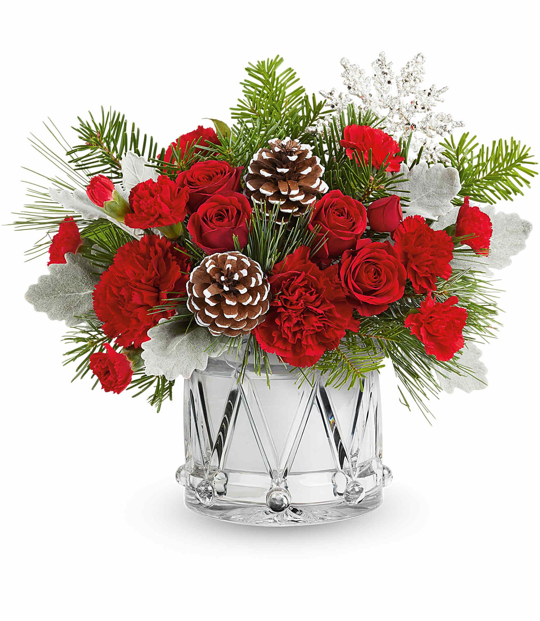 March Of Joy Bouquet - March of Joy Bouquet brings festive cheer with vibrant red blooms and frosted greenery, all arranged in Teleflora's keepsake Crystal Drum Vase. A joyful addition to any holiday celebration.
