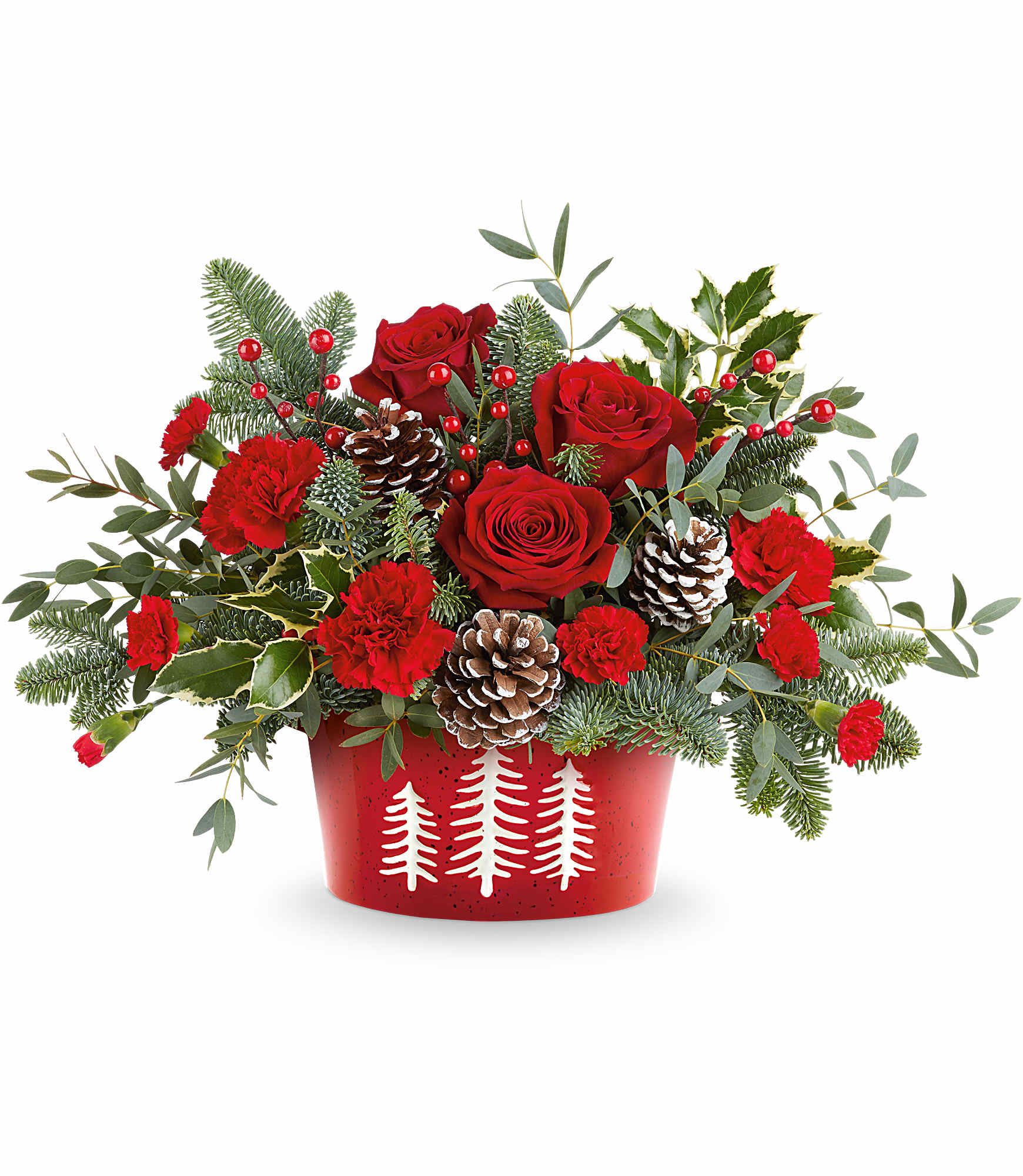 Winter Whimsy Centerpiece  -  Winter Whimsy Centerpiece brings festive cheer to your table. Red roses, rich evergreens, and frosted pinecones are beautifully arranged in our Snowy Pines Dish-perfect for Christmas or winter gatherings.