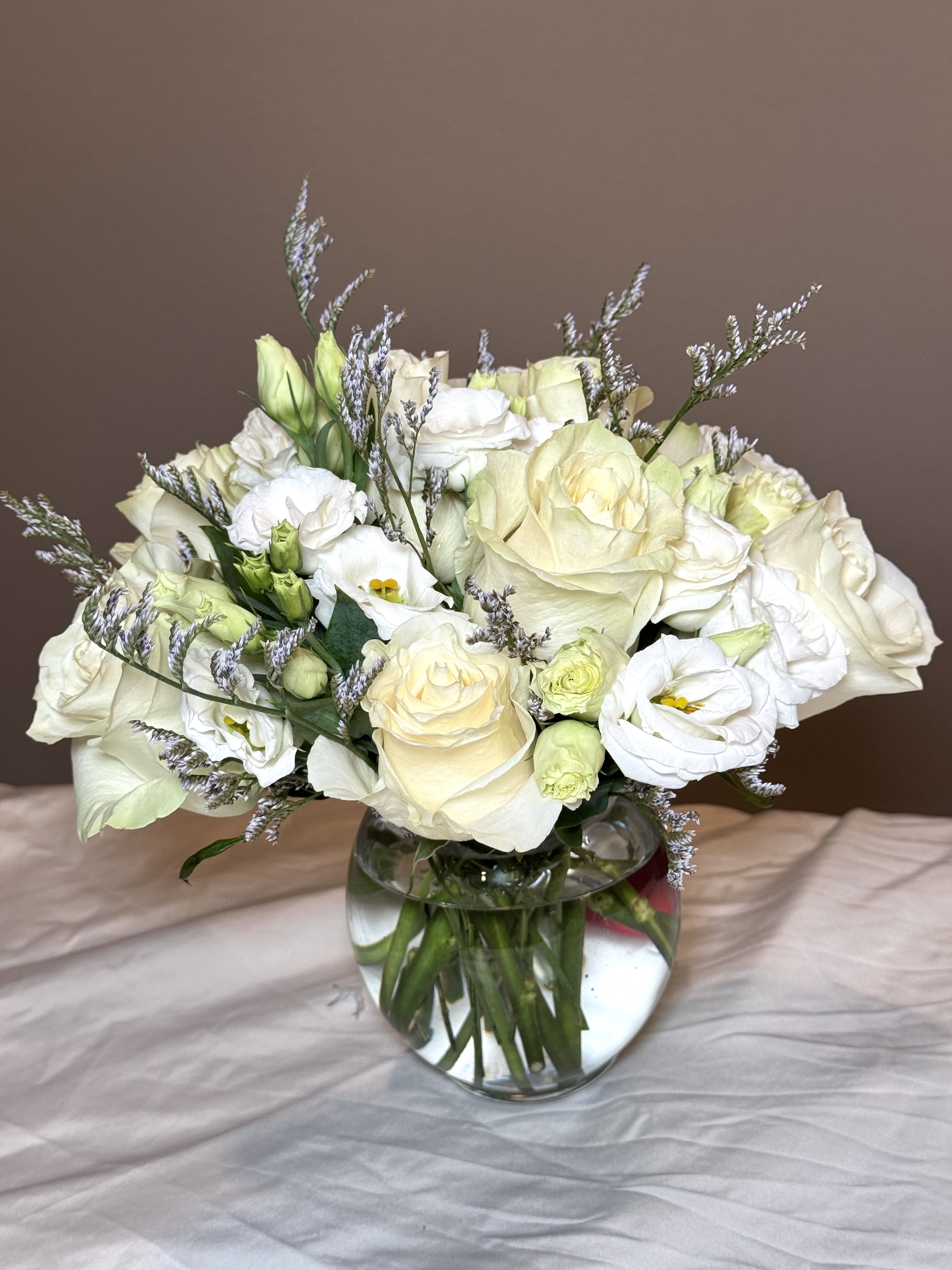Heavenly Beauty - A divine bouquet that seems to come from the heavens themselves. Each white rose represents purity and perfection, creating a stunning arrangement that’s sure to take anyone’s breath away.