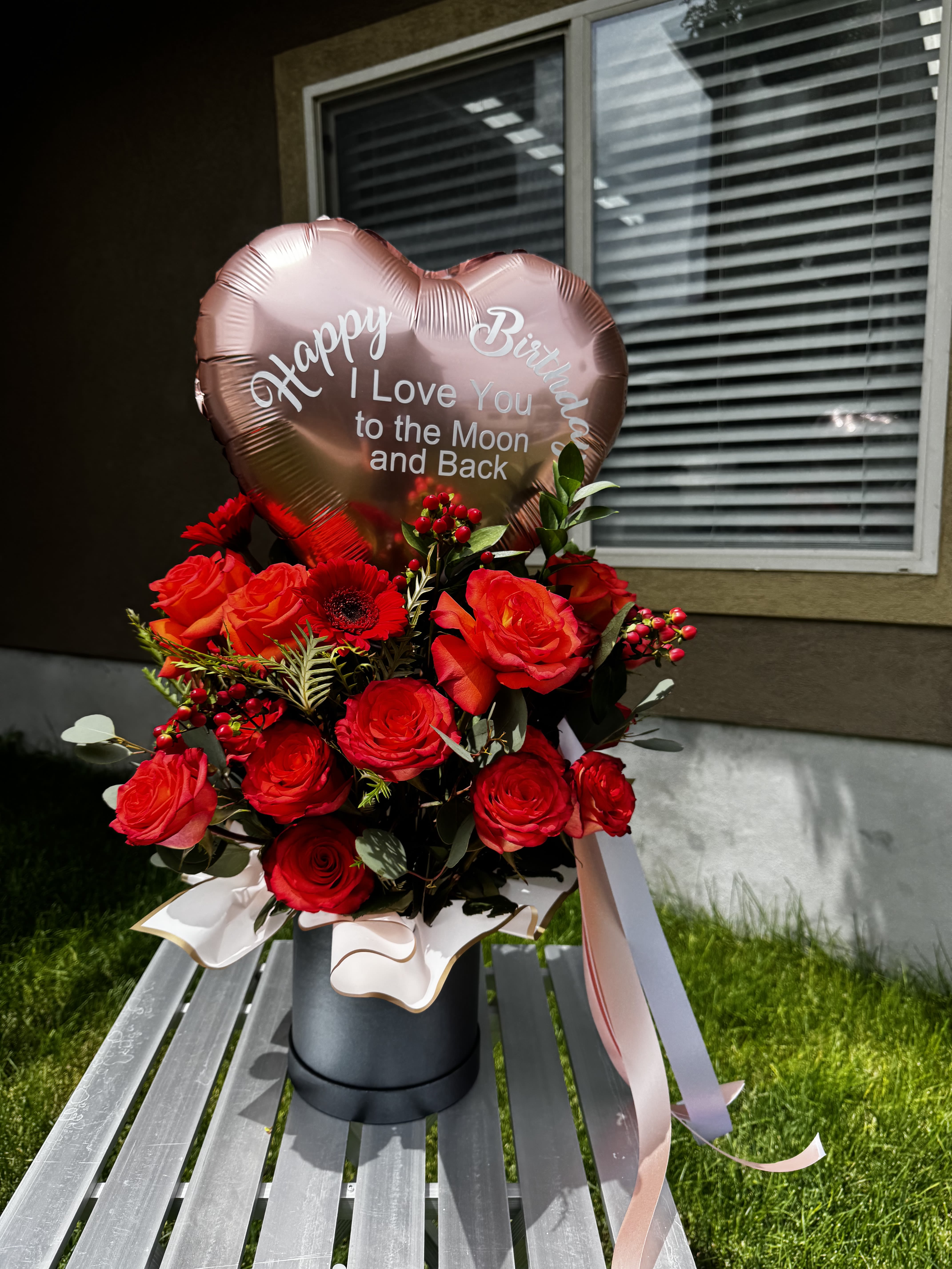 Radiant Blooms Box - Brighten any occasion with our Radiant Blooms Box, a vibrant mix of orange roses, red gerbera daisies, and seasonal greenery. Presented with a beautiful heart-shaped balloon (customizable message), this floral box is perfect for birthdays, anniversaries, romantic surprises, thank you gifts, and more. A stunning floral gift handcrafted in West Jordan, Utah, to celebrate life’s special moments.  #RadiantBloomsBox #FreshFlowersWestJordan #OrangeRoses #RedGerberas #HeartBalloonFlowers #BirthdayFlowers #AnniversaryFlowers #RomanticGift #ThankYouFlowers #CelebrateWithFlowers #SendFlowersWestJordan #UtahFlorist #WestJordanFlorist #LuxuryFlowerBox