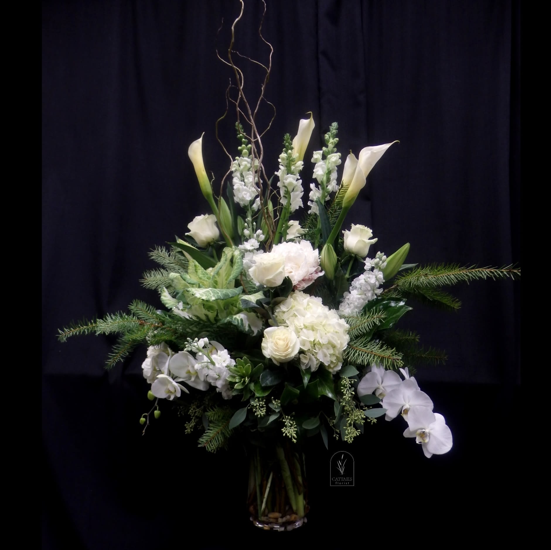 Deck the Halls - A Stunning Grand collection of all white Holiday splendor using Hydrangea, Orchids, Callas, Kale , Roses, Lilies Etc. 