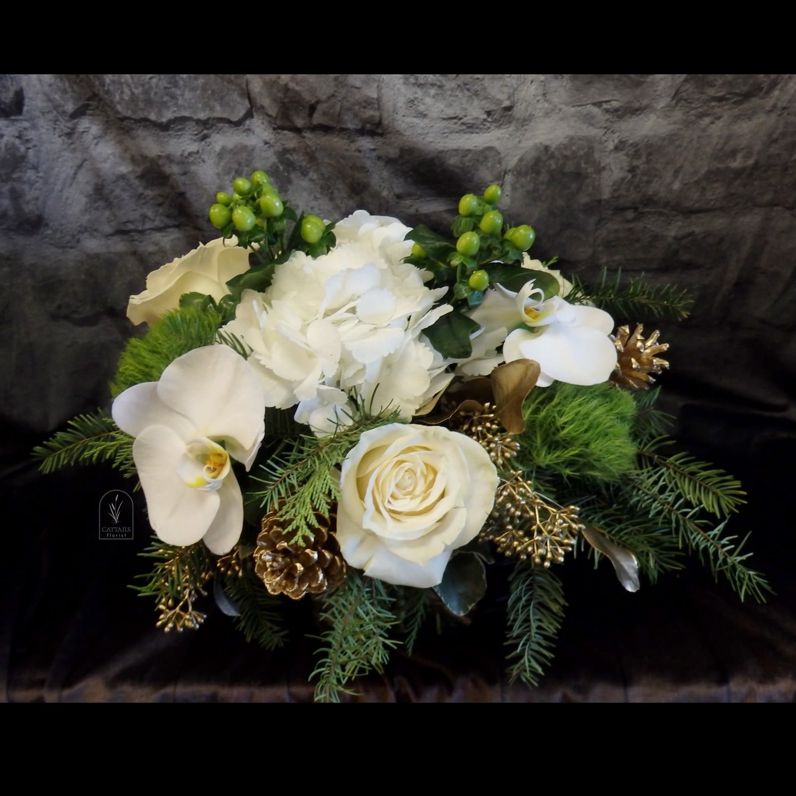 Five  Golden Rings - Compact style Christmas elegance in Gold and White. Hydrangea, Roses, Orchids, Green Trick, Hypericum and accents of Gold, Seeds and pinecones