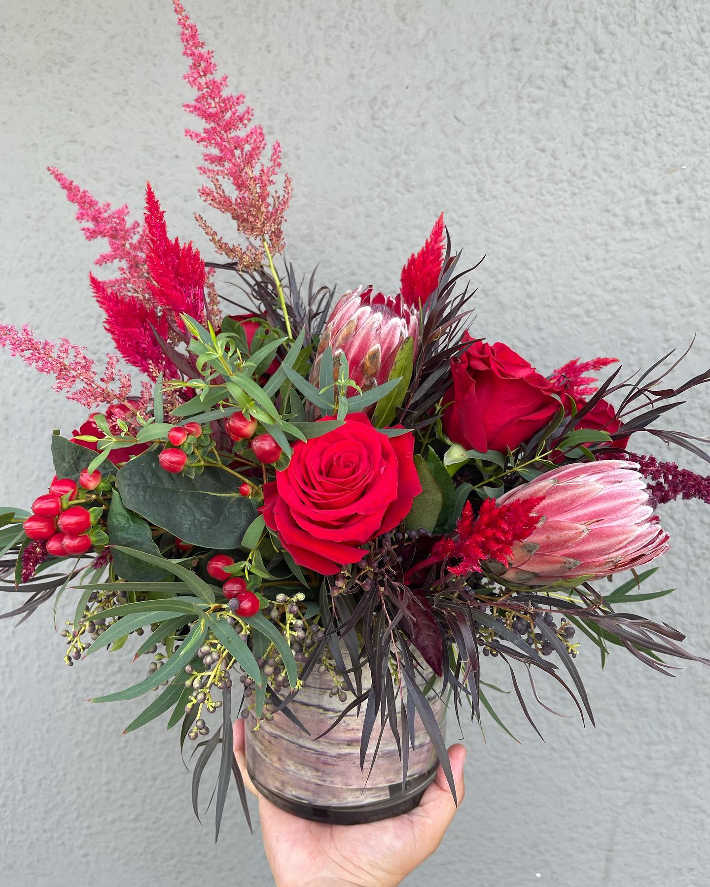 Rustic Love - Seasonal rustic flowers arranged into a vase. 