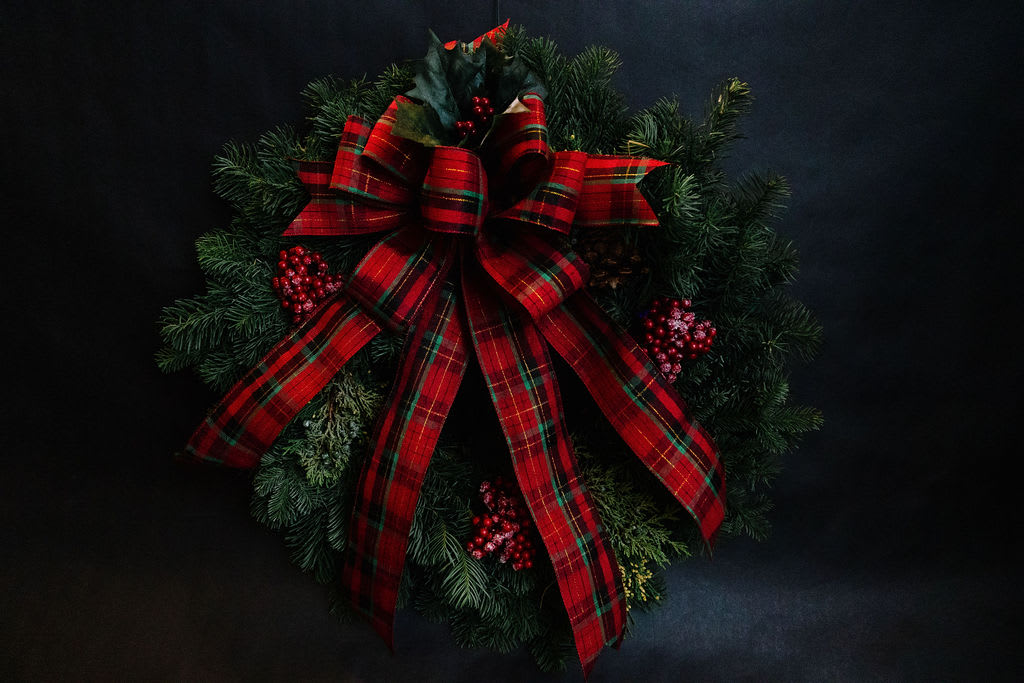 Celebration Wreath - A 24&quot; classic mixed pine wreath decorated with a holiday plaid ribbon, cones and berries