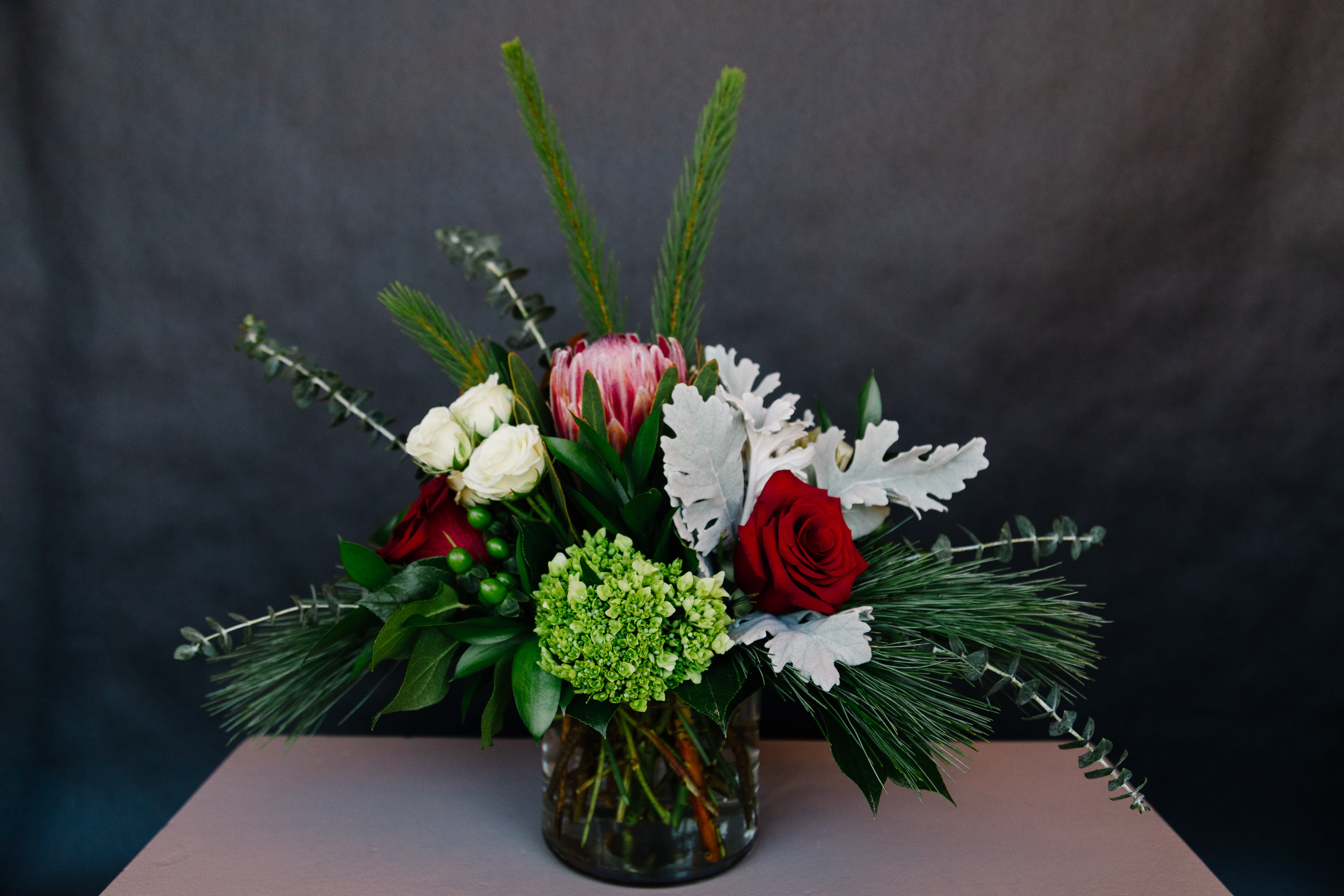 Christmas Spirit - Winter pine with red, green and white flowers to add just a touch of Holiday Spirit 