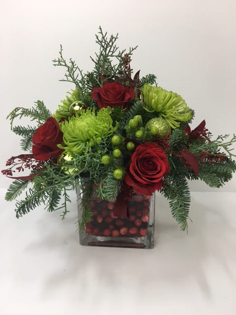 'tis the season - What better way to say Christmas with this wonderful berry bowl with holiday greens, red roses , green mums, hypericum and shiny orbs