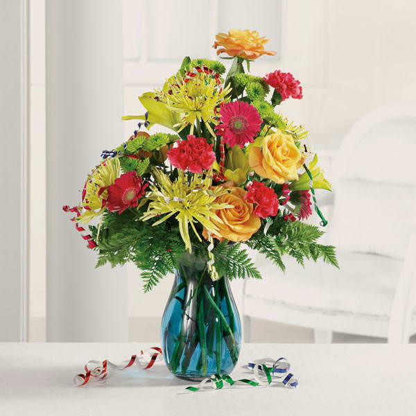 Birthday Stems &amp; Streamers - It's a birthday party in a vase! Roses, Fuji mums, Asiatic lilies, carnations and Gerbera daisies all decked out with streamers and your "Happy Birthday" wishes.