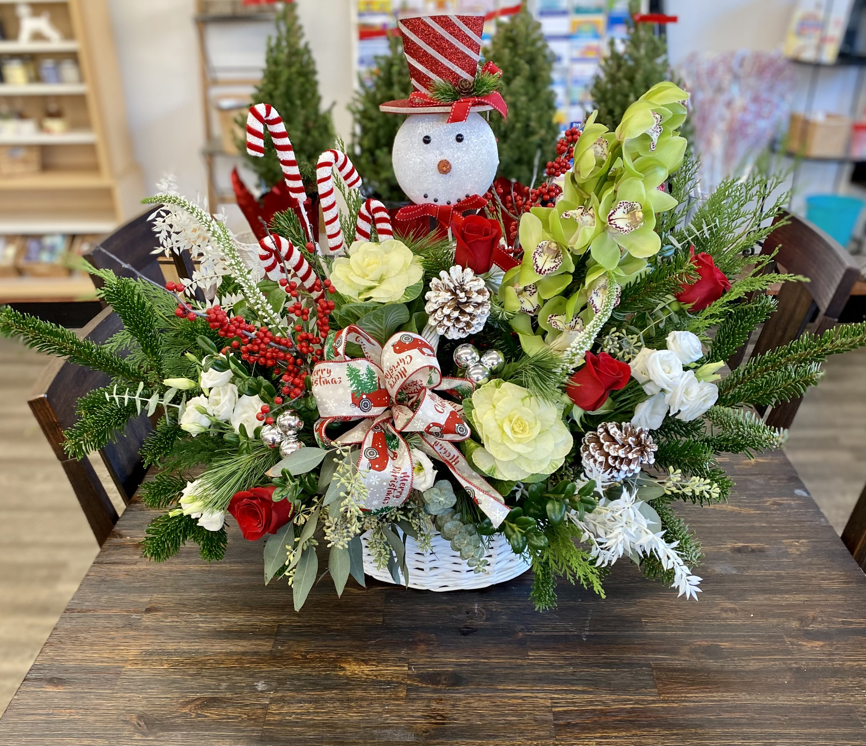 Winter Wonderland - A Large beautiful Christmas basket filled with winter greens, roses, orchids, berries and Christmas fun!