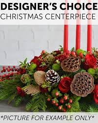 DESIGNER'S CHOICE CHRISTMAS CENTERPIECE - This order will be designed as a centerpiece.  The designer will use the freshest flowers and greens to create a wonderful holiday centerpiece for you. Photo is for reference only. Your arrangement may or may not look similar to the photo.