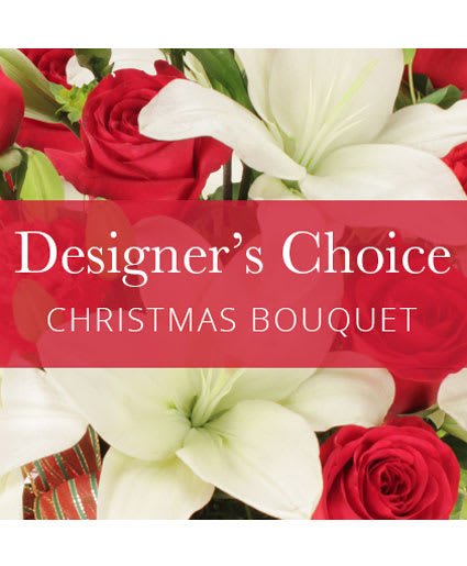 DESIGNER'S CHOICE CHRISTMAS ARRANGEMENT - This order will be designed in a holiday container..  The designer will use the freshest flowers and greens to create a wonderful Christmas arrangement for you. Photo is for reference only. Your arrangement may or may not look similar to the photo.