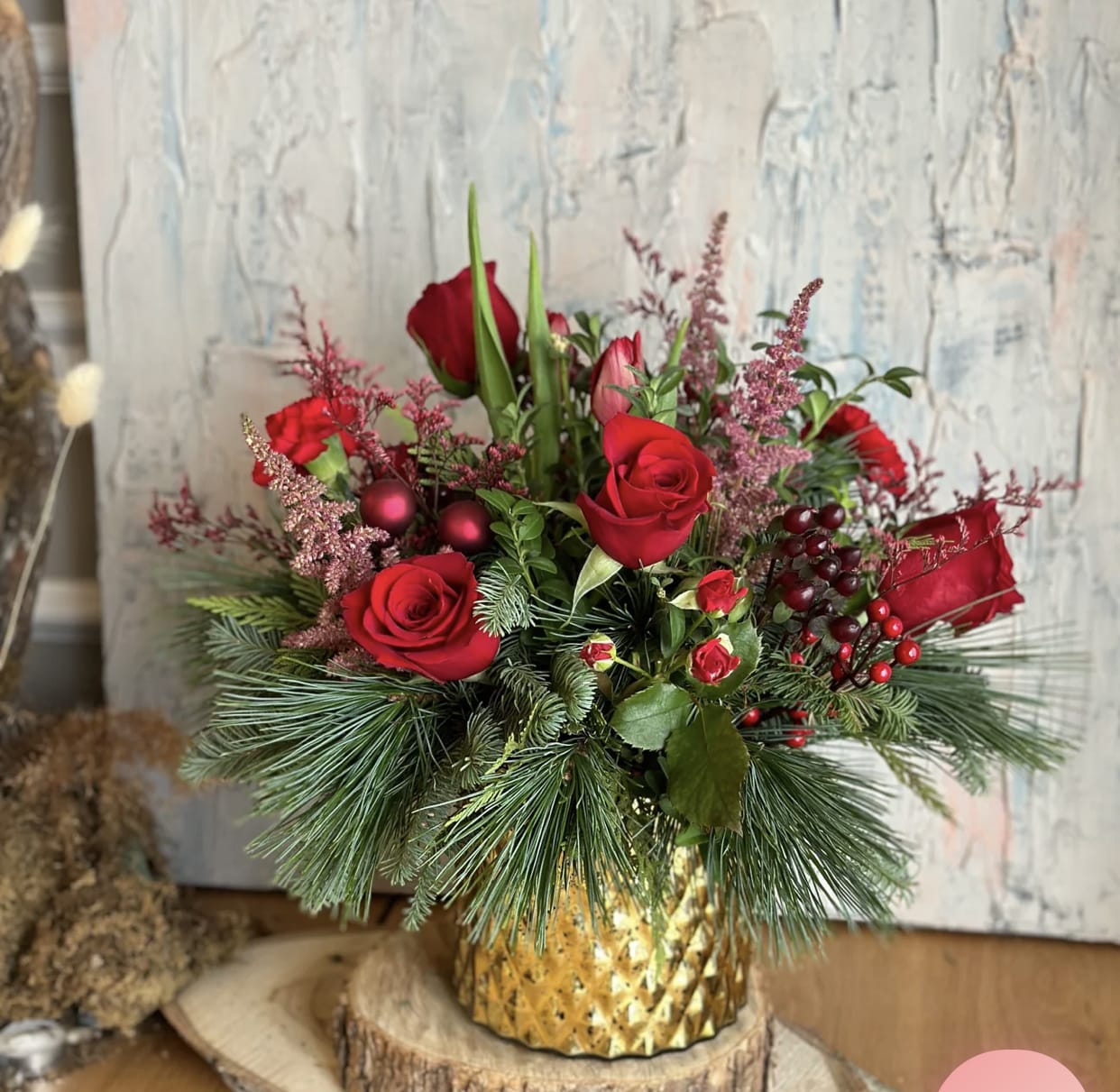 Winter Delight - The Winter Delight arrangement offers the option of white flowers, red flowers, or a mix of both, allowing you to customize the arrangement to your preference.  Embrace the beauty and enchantment of the winter season with our Winter Delight arrangement. Whether you choose white, red, or a mix of both, let this exquisite display in a gold vase infuse your space with elegance, warmth, and holiday spirit. Celebrate the joys of winter with this captivating arrangement that truly delights the senses.