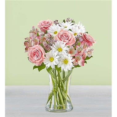 Her Special Day - Our beautiful bouquet will make every special mom feel loved. Sweet pink and white blooms are arranged in a classic glass vase, creating an unforgettable Mother’s Day surprise, no matter how far away you are. For a limited time only, send twice the flowers for free! All-around arrangement with pink roses, Peruvian lilies (alstroemeria) and waxflower, white daisy poms; accented with assorted greenery For a limited time, send twice the flowers for the same price Artistically designed in a clear glass vase; measures 8&quot;H Large arrangement measures approximately 16&quot;H x 12&quot;W Small arrangement measures approximately 14&quot;H x 11&quot;W Our florists hand-design each arrangement, so colors, varieties and container may vary due to local availability To ensure lasting beauty, lilies may arrive in bud form and will fully bloom over the next few days