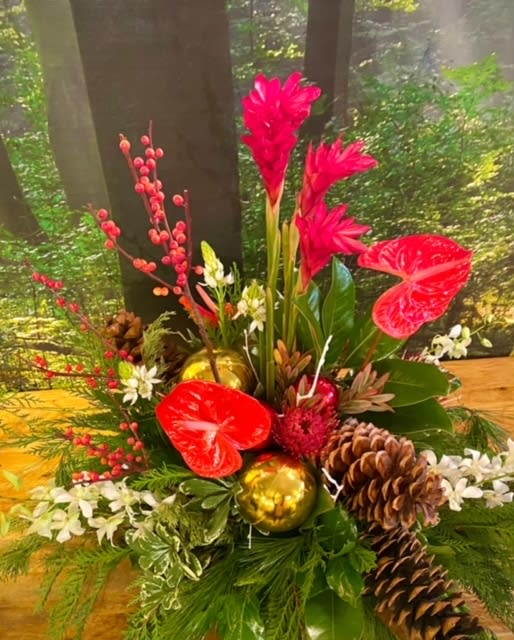 Grand Holiday - Evergreen boughs, holly, winterberry, Christmas ornaments, and a mix of tropical and long-lasting garden flowers are designed to create this grand and inspiring Holiday Design. This is designed in a low dish, and is perfect for a large table, buffet or island