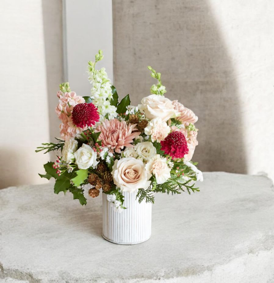 Bucket of Cheer - Introducing the Bucket of Cheer™ — a soft, romantic seasonal arrangement designed for clients who love refined elegance with a touch of winter charm.  Nestled in a galvanized metal bucket, this design blends creamy garden roses, blush spray roses, soft peach mums, winter whites, and pops of berry-red blooms, creating a warm yet festive palette perfect for any home, office, or holiday gathering.  Textured with seasonal greenery, petite pinecones, holly accents, and delicate winter foliage, this arrangement beautifully balances modern minimalism with cozy holiday sophistication.  Perfect as a holiday gift, corporate desk floral, entryway accent, or winter celebration centerpiece, the Winter Blush Holiday Bucket™ brings the signature Bloom In Glory luxury aesthetic to any space.  ⸻  	•	Winter blush floral arrangement 	•	Holiday flower bouquet Orlando 	•	Blush and red winter flowers 	•	Christmas floral gift Orlando florist 	•	Winter centerpiece arrangement 	•	Galvanized bucket flower design 	•	Bloom In Glory Florist Orlando holiday collection 	•	Elegant holiday flowers 	•	Luxury winter floral arrangement   winter arrangement, holiday bouquet, blush Christmas flowers, winter centerpiece Orlando, luxury florist Orlando, blush roses holiday, galvanized bucket flowers, seasonal florals, Bloom In Glory holiday florals 