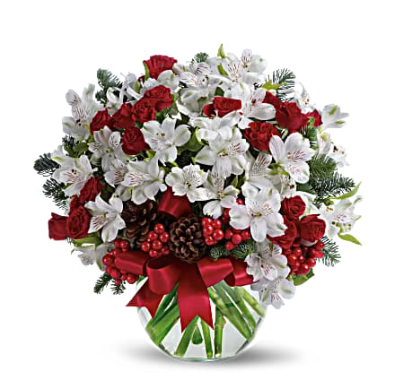 Let It Snow - Fresh as new fallen snow. Delicate, snow white flowers are decorated with berries and pine cones for a unique spin on tradition. Presented in a crystal clear bowl tied with red ribbon, this Christmas floral arrangement is exceptionally value priced.
