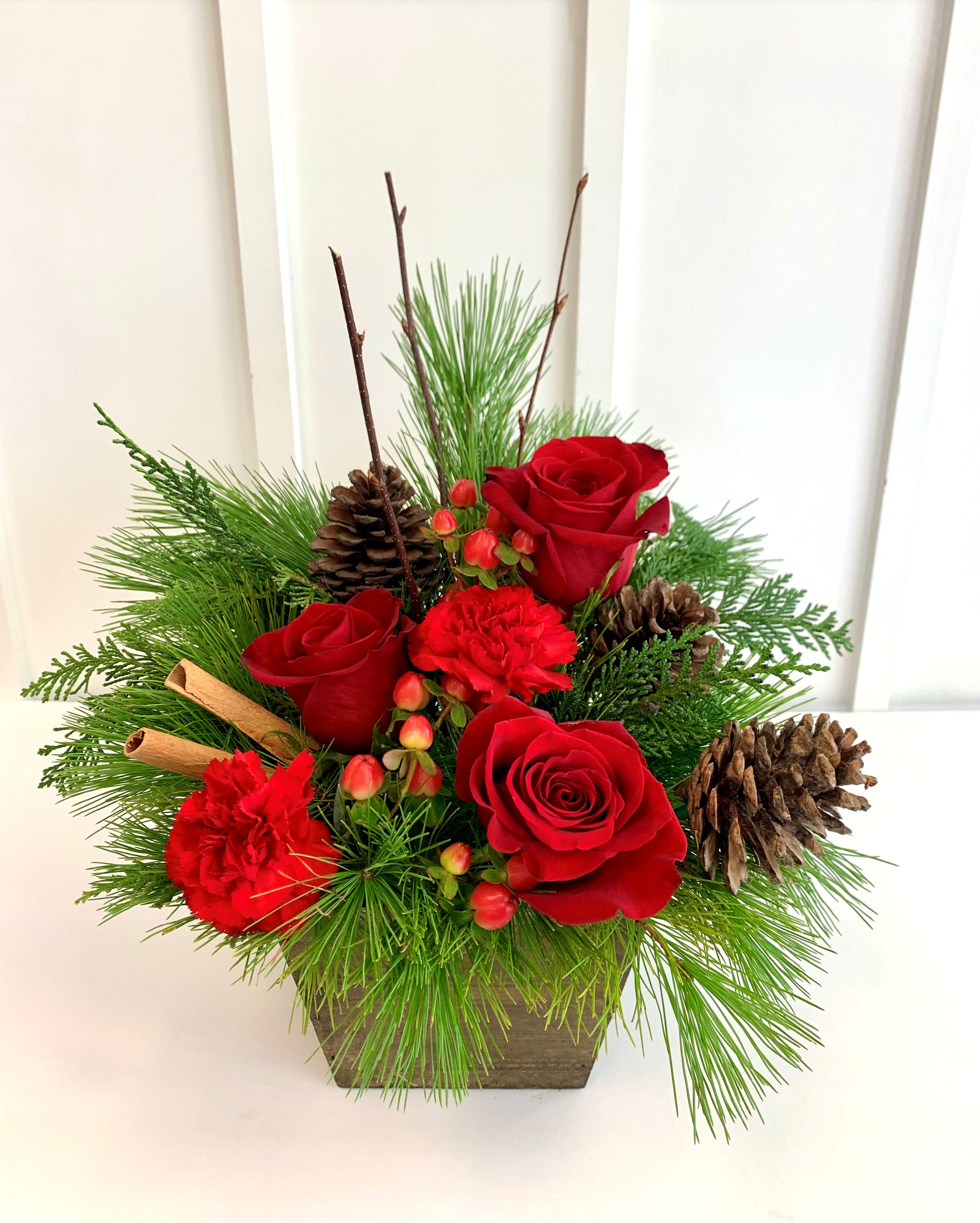 Berries and Spice - A festive arrangement that brings the spirit of Christmas into full bloom! Adorned with vibrant red and green hues, this arrangement is a harmonious blend of seasonal splendor.