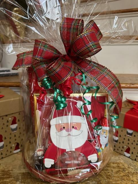 Santa's Goodies Basket - Santa's Goodies Basket is filled with Godiva Chocolates, Holiday Hard Candy, Too Good Gourmet Brownie Cookie, Peppermint Cookies, Rohan Chocolate Santa and a Marshmallow Pop.