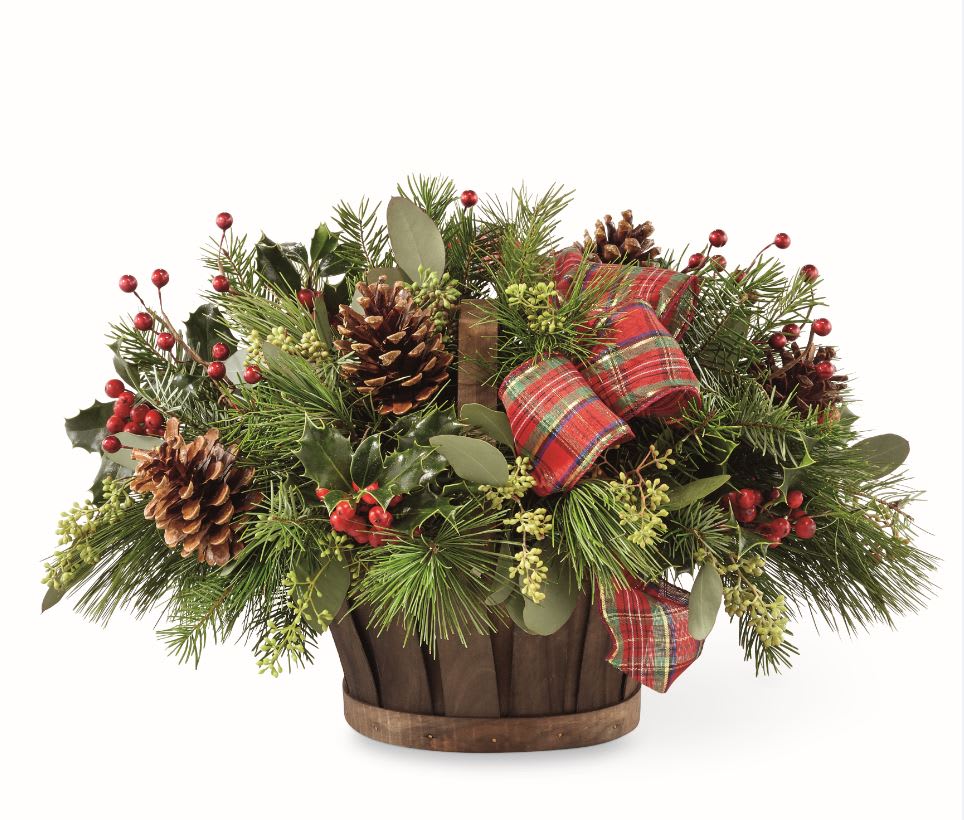 HOLIDAY HOMECOMINGS™ BASKET - An oval stained woodchip basket with Christmas greens, berries and pine cones cheerful sentiment for the holidays.
