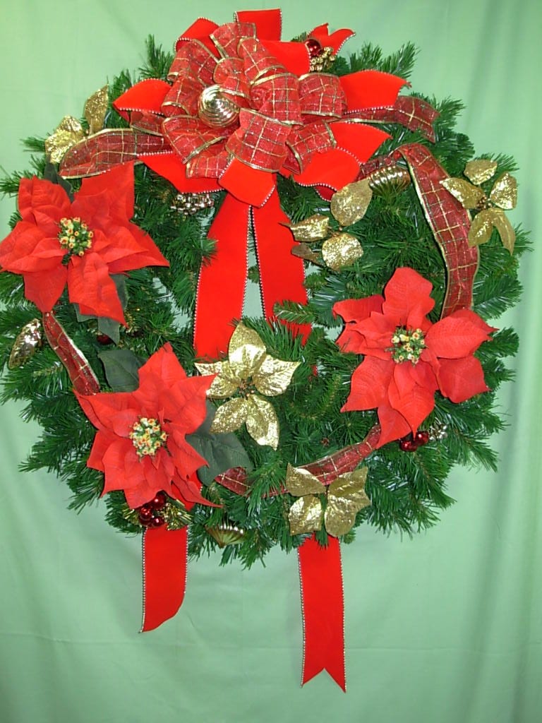-- GOLD &amp; RED POINSETTIA WREATH --   NEW-C94 - Our GOLD &amp; RED POINSETTIA WREATH is made of permanent   silk fur Christmas  greens, with large red silk poinsettia blooms festooned with gold Christmas ornaments and gold and red velvet Christmas ribbon.. This wreath is a  LARGE  30 inches in diameter and can be used for many holiday seasons to come.