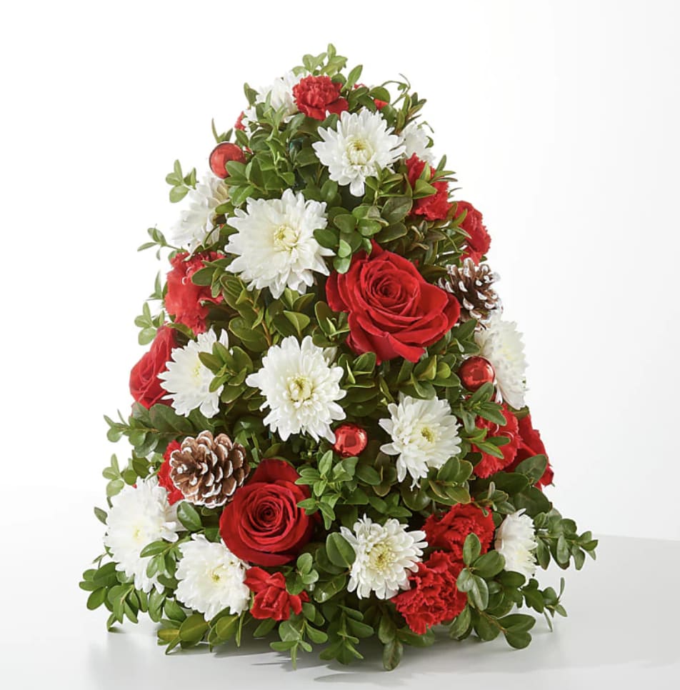 Let It Snow Tree - Stay warm by bringing the beauty of the season indoors with our Let It Snow Tree, a fun addition to any room. Designed by florists, ready to display. For long–lasting blooms, add water daily. Pet Safety Precautions: This bouquet or plant may include flowers and foliage that are known to be toxic to pets. To keep them safe, be sure to keep this arrangement out of your pet's reach.  BLOOM DETAILS Rose Carnation  To guarantee the freshest bouquet possible, our florists may replace some stems in your arrangement which could differ in color and variety. See Substitution Policy. 
