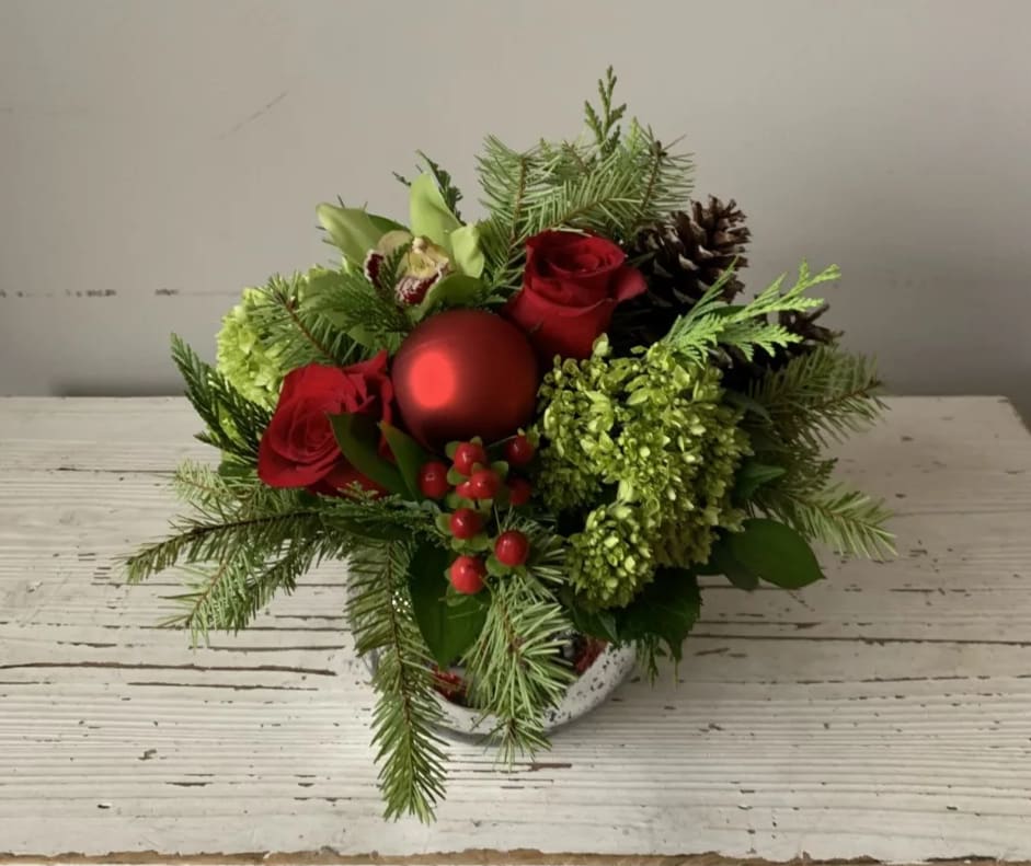 Feeling Festive - Santa's little helper comes in a 5" mercury glass bubble bowl.  It features red and green blooms, pinecones, and ornaments - festive for sure!  The upgraded version will have more flowers in the same size container.